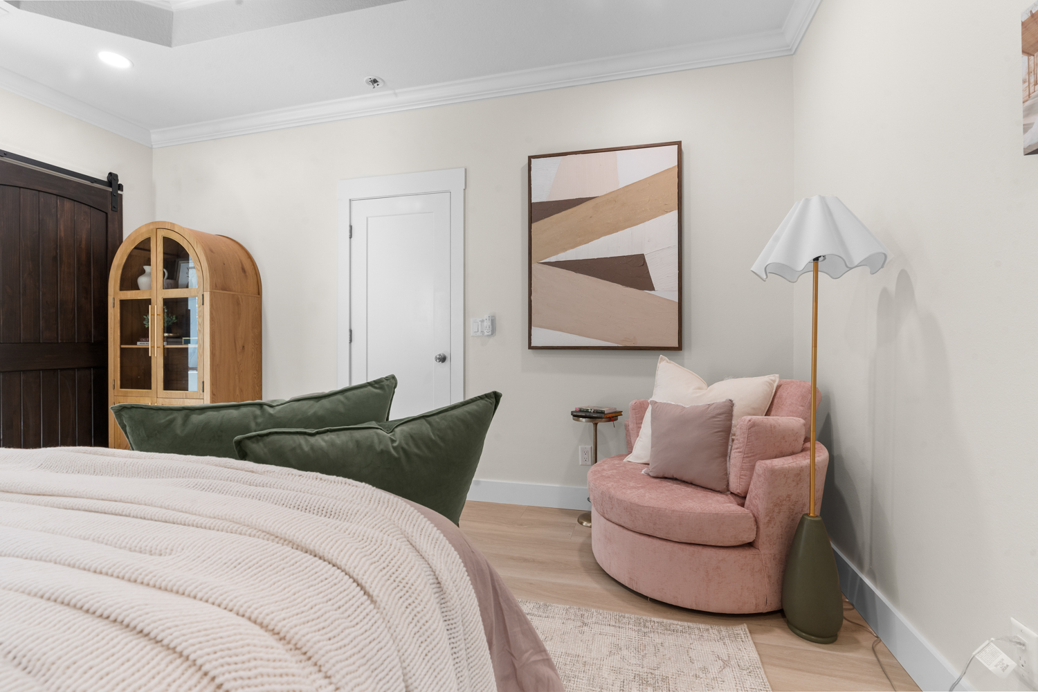 Full-service interior design — styled sitting area with blush accent chair